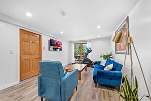 Deluxe Room, 1 King Bed, Patio, Courtyard View | Living area | 43-inch Smart TV with digital channels, offices