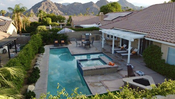 A residential backyard with a swimming pool, patio furniture, and a view of mountains. - 3bed 2bath House.  Private Pool and Spa. Close to Acrisure Center  (Indian Wells)