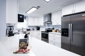 Fridge, microwave, oven, stovetop - Entire Satellite Beach Home | 8 Min Walk to Ocean | Private Pool | 4 Bed 2 Bath (Satellite Beach)