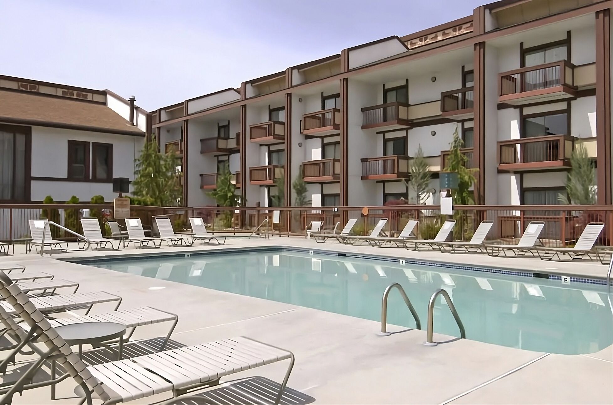 Soak up the sun beside the sparkling pool and loungers.