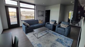 Executive Suite River and Street View | Desk, laptop workspace, blackout drapes, iron/ironing board