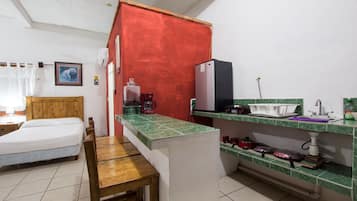 Mini-fridge, microwave, blender, cleaning supplies