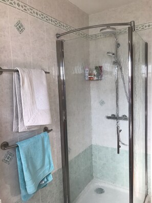 Bathtub, hair dryer, towels, soap