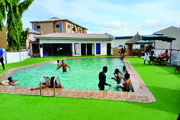 2 outdoor pools, open 7:00 AM to 9:00 PM, pool umbrellas