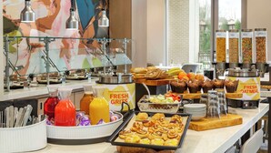 A buffet with various food items, including pastries, fruits, and beverages. - Hilton Garden Inn Nashville West End Avenue (Nashville)