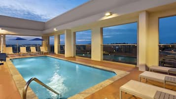 Seasonal outdoor pool, open 8:00 AM to 10:00 PM, sun loungers