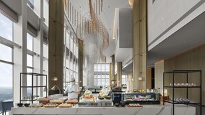A modern hotel lobby with a marble reception desk, a chef preparing food, and a view of the cityscape. - Hilton Zhuji (Shaoxing)