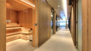 A modern spa area with wooden benches and a sauna. - Stallion d15 MEGEVE (Megève)