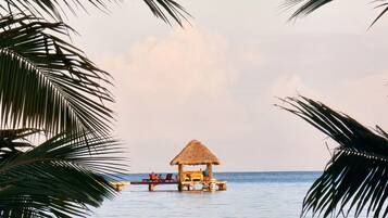 On the beach, sun-loungers, beach towels