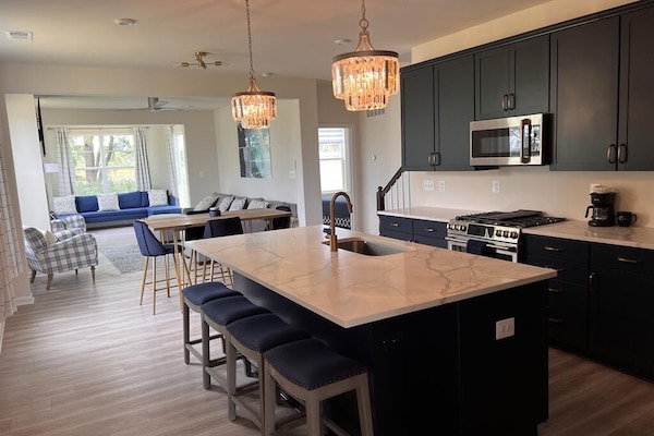 brand new state of the art kitchen with GE Cafe Appliances.
