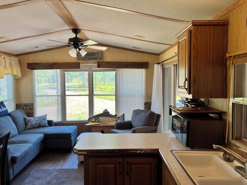 Parkmodel cabin w screened porch in campground on bike trail.