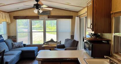 Parkmodel cabin w screened porch in campground on bike trail.