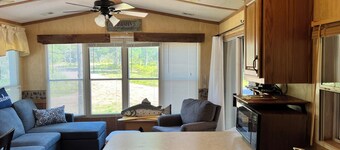 Parkmodel cabin w screened porch in campground on bike trail.
