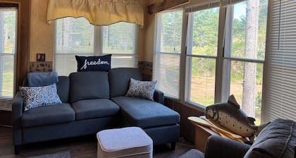 Parkmodel cabin w screened porch in campground on bike trail.