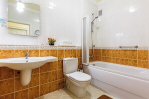 Standard Apartment | Bathroom | Slippers - Europa Residence (Atyrau)