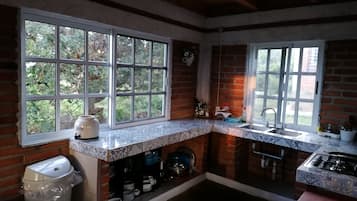 Family Cabin | Private kitchen | Stovetop, cookware/dishes/utensils, cleaning supplies, ice maker
