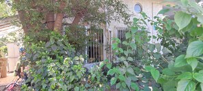 Secure residence with a traditional façade and garden.