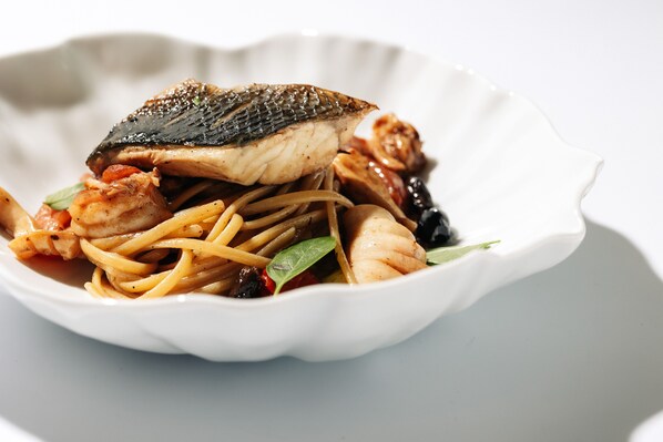 A dish of fish and noodles on a white plate. - The Hotel Ljubljana (Ljubljana)