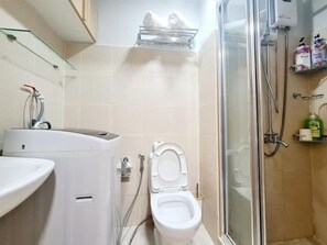 Shower, hair dryer, towels, soap