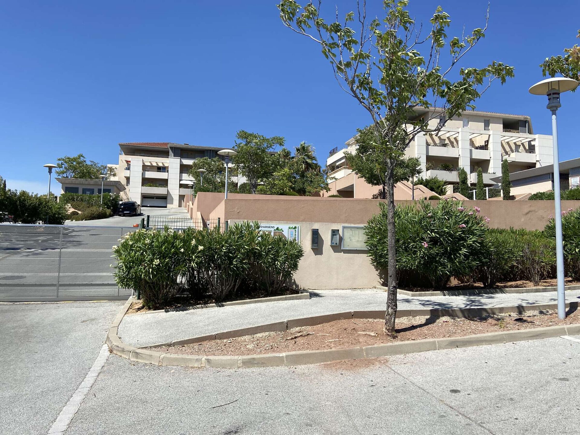 A parking lot with a building in the background.