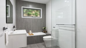 Bathtub, hair dryer, towels