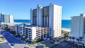 A multi-story hotel with a parking lot and a view of the beach. - New Private Ashworth Resort Direct Oceanfront View (North Myrtle Beach)