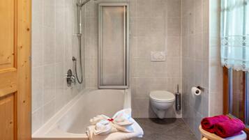 Bathtub, hair dryer, towels