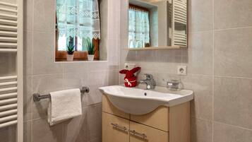 Bathtub, hair dryer, towels