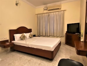 Minibar, desk, laptop workspace, iron/ironing board