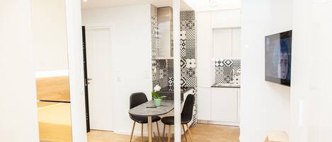 Deluxe Studio | Living area | TV