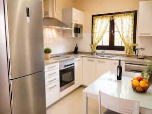 Coffee/tea maker, fridge, microwave, oven