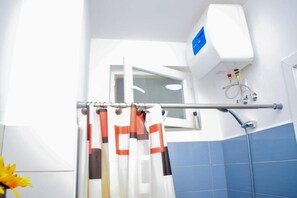 Executive Apartment | Bathroom | Slippers - Guitar Apartment Zanzibar (Kombeni)