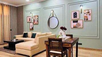 Luxury Apartment | Living area | 38-inch LCD TV with digital channels, TV