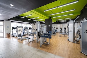 Stay fit and active in our well-equipped gym featuring treadmills and weight stations.