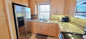 Condo, 3 Bedrooms | Private kitchen | Fridge, oven, coffee/tea maker, toaster