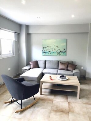 Deluxe Apartment | Living area | TV