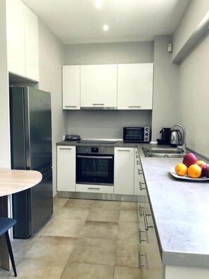 Deluxe Apartment | Private kitchen | Microwave, oven, coffee/tea maker - Charming Apartment in Faliro (Palaio Faliro)