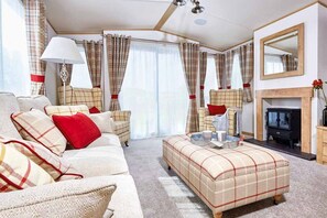 Indulgent 8 Berth Caravan with Hot Tub Pet Free | Living area | Flat-screen TV - Appletree Holiday Park (Boston)