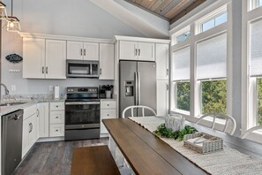 Enjoy cooking in this well-equipped kitchen with an oven, microwave, and refrigerator.