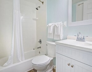 Combined shower/tub, hair dryer, towels, soap