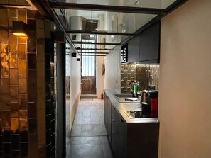 Fridge, microwave, stovetop, coffee/tea maker