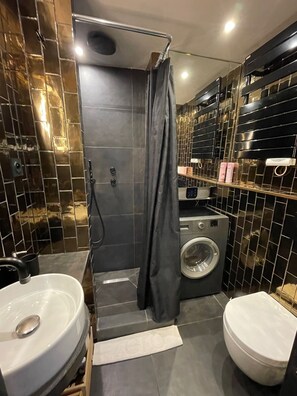 Shower, hair dryer, towels, soap