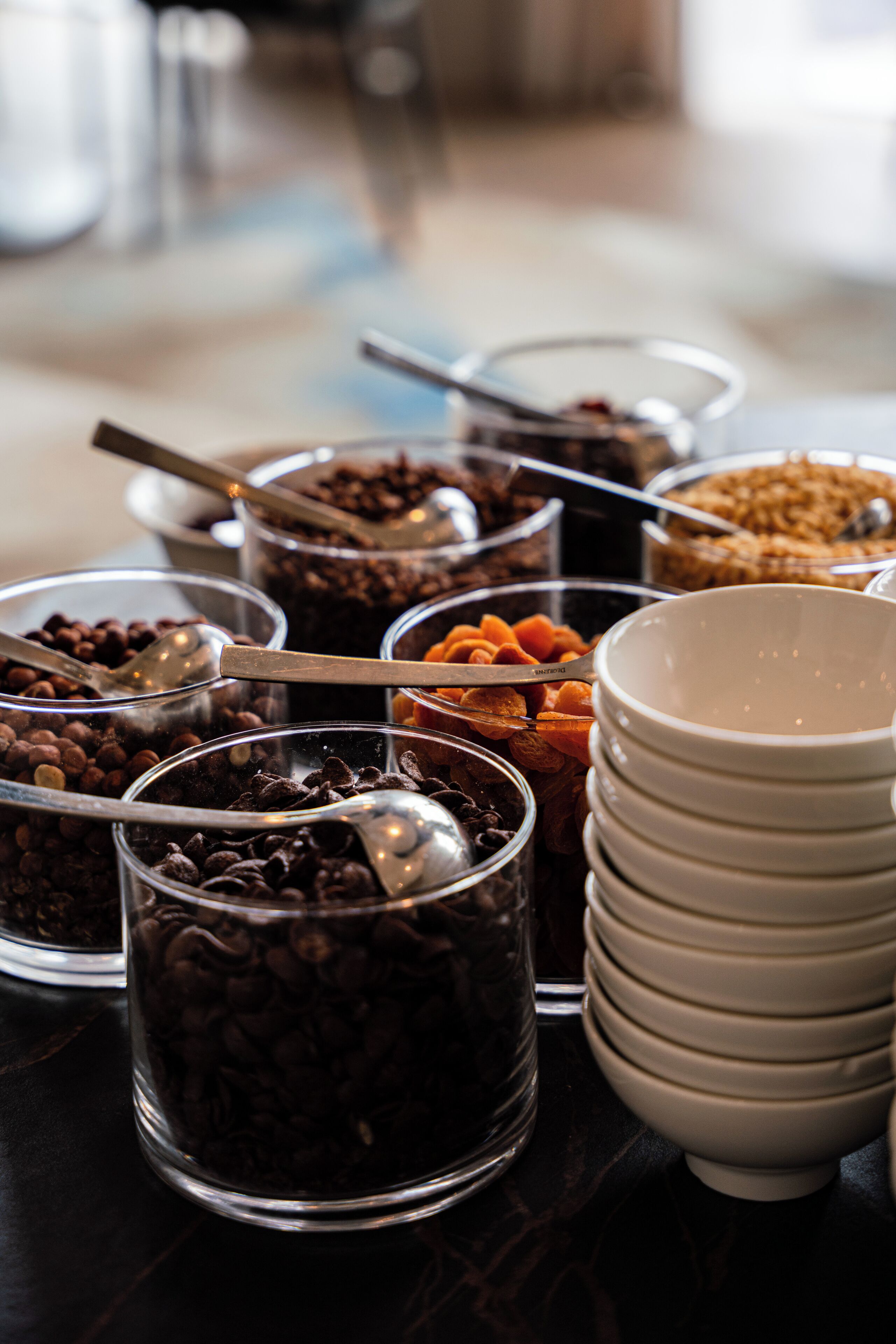 A buffet with various food items and serving utensils.