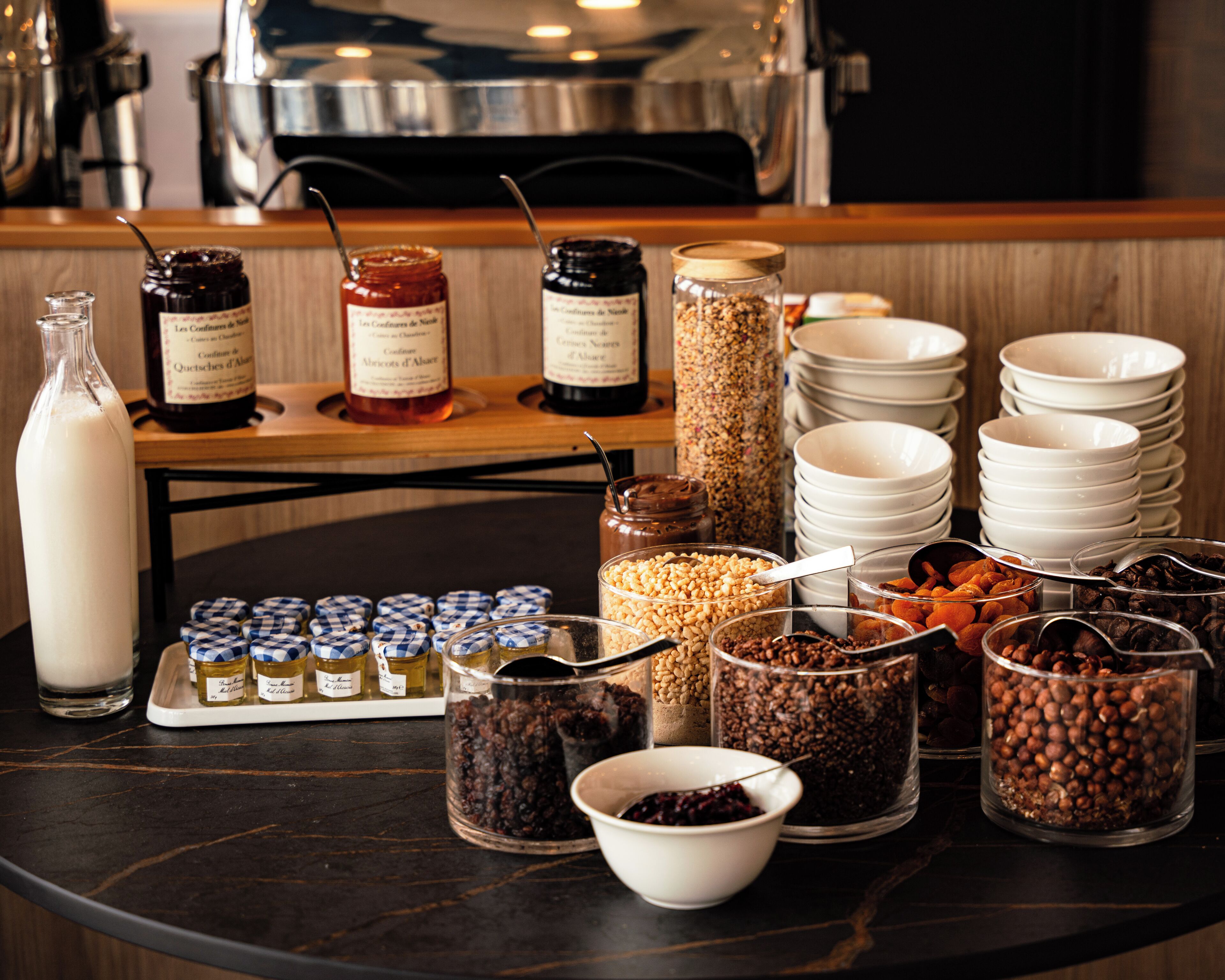A breakfast buffet with various food items and condiments.