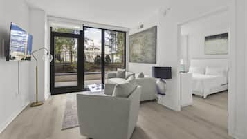 Deluxe Apartment, 1 Bedroom, Balcony (Room décor/layout/colors vary by unit) | Living room | 42-inch flat-screen TV with cable channels, TV, Netflix