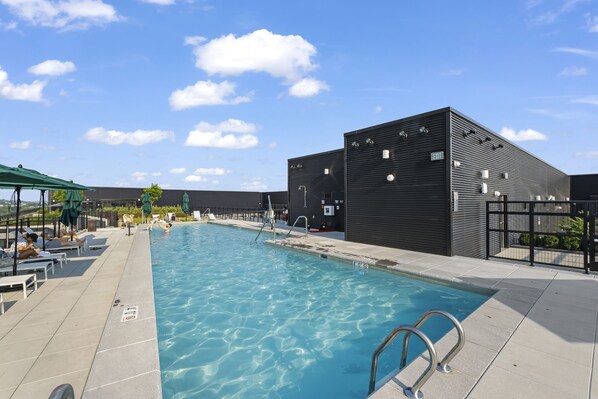 Seasonal outdoor pool, pool umbrellas, pool loungers