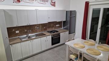 Fridge, oven, coffee/tea maker, cookware/dishes/utensils