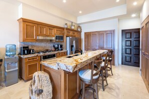 Fridge, microwave, oven, stovetop - Serenity Ocean View 2 BR Condo in Quivira (Cabo San Lucas)
