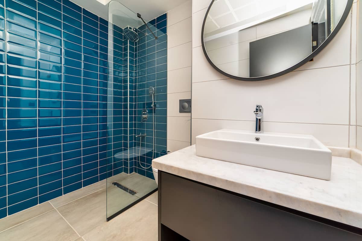 shower, designer toiletries, hair dryer, slippers