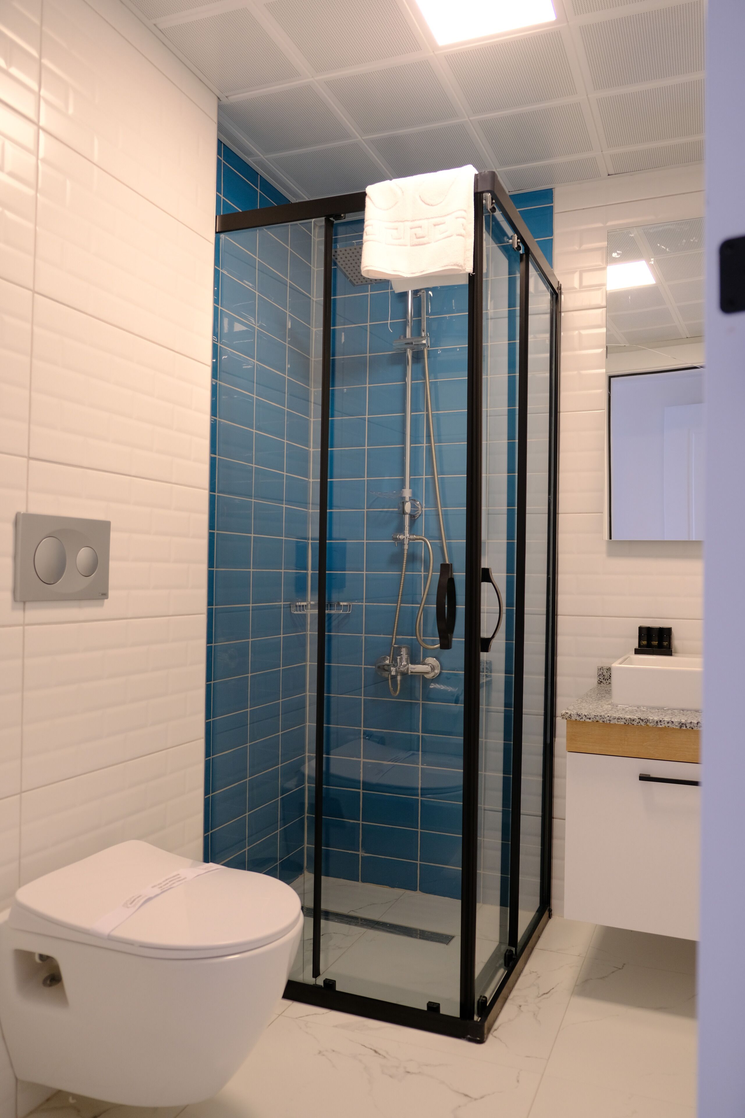 standard double or twin room | bathroom | shower, designer toiletries, hair dryer, slippers